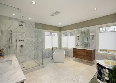 A large bathroom with a large tub and shower.